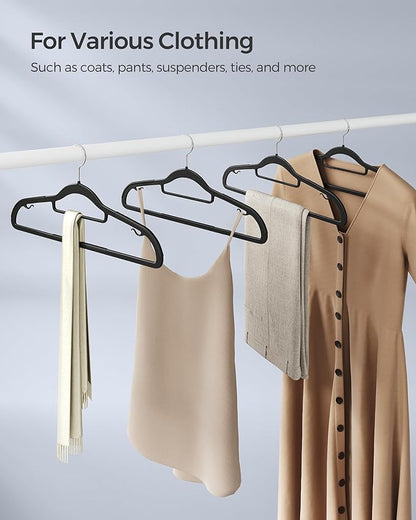 SONGMICS Pack of 30 Coat Hangers, Space-Saving Plastic Clothes Hangers, Non-Slip, 0.2 Inches Slim, 16.5 Inches Wide, 360° Swivel Silver Hook, Black UCRP20BK30
