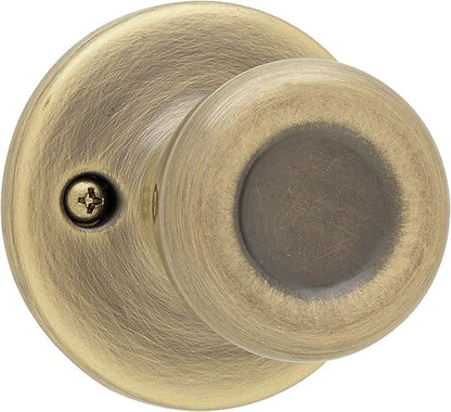 Kwikset Tylo Dummy Door Knob, Single Sided Handle for Closets, French Double Doors, and Pantry, Antique Brass Non-Turning Interior Push/Pull Door Knob, with Microban Protection